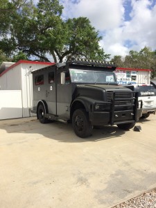 Custom Armored truck limo with custom bumper, hid headlights, light bar and matte black dip