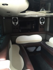 Armored truck with McLaren audio system, Fiber optic mirrored roof, sunroof, multicolor LED's, and Brown and White Ostrich seats.
