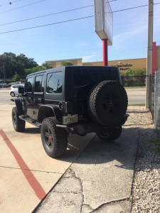 4" Rough Country lift kit installed on 2015 Jeep Wrangler Unlimited.