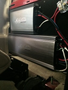 Amplifiers mounted behind rear seats