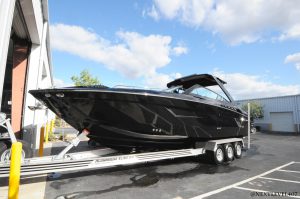 Black-Cruiser-Yacht-JL-Audi-Speaker-Fusion-LED-Lights-Next-Level-Inc-Custom-Boat-On-Trailer-Full-Profile2