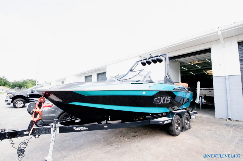 Teal-Axis-Boat-On-Malibu-Trailer-Profile-Next-Level-Inc-Sea-Dek-Marine-Products-Certified-Fabricators-And-Installers