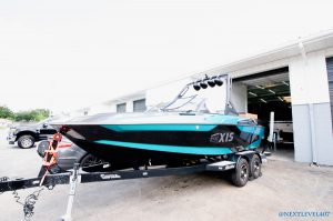 Teal-Axis-Boat-On-Malibu-Trailer-Profile-Next-Level-Inc-Sea-Dek-Marine-Products-Certified-Fabricators-And-Installers