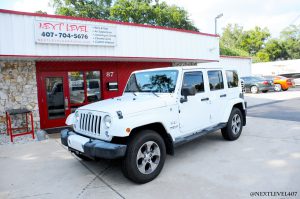 White-Jeep-Wrangler-Sahara-4-Door-Next-Level-Inc-Store-Front-Custom-Install K40 Laser Sensor-Full-Profile-Driver-Side