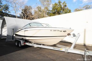 White-Regal-Boat-7-JL-Audio-Speakers-Sea-Dek-Marine-Flooring-Custom-Next-Level-Inc-On-Trailer-Full-Profile