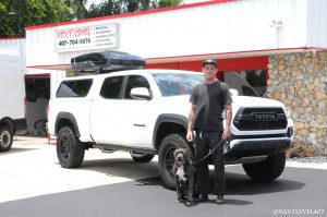 White-Toyota-Tacoma-Custom-Install-Next-Level-Inc-Store-Front-Full-Profile-Pro-BMX-Rider-Rockstar-Energy-Drink-Dog