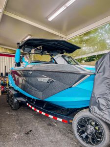 Next Level Orlando shows the exterior of the upgraded Nautique G25 Paragon wakeboard boat with custom color changing lights.