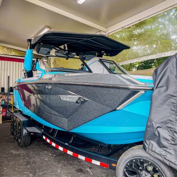 Next Level Orlando shows the exterior of the upgraded Nautique G25 Paragon wakeboard boat with custom color changing lights.