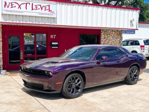 Challenger Featured photo. Challenger. Feature photo. Subwoofer upgrade. Feature photo. Next level in background. Next Level Customs. Next Level Inc. Orlando Custom Audio.