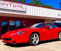 Red Ferrari, in front of Next Level. Next Level Customs. Next Level Audio. Orlando Custom Audio.