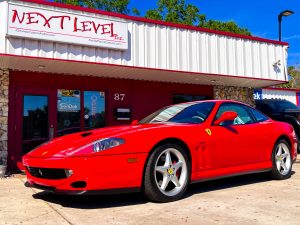 Red Ferrari, in front of Next Level. Next Level Customs. Next Level Audio. Orlando Custom Audio.