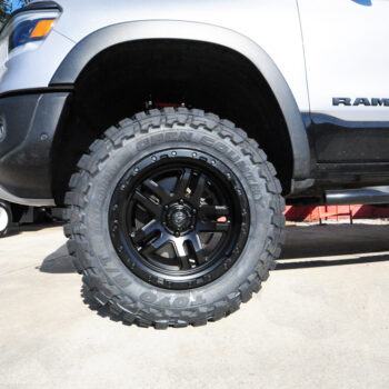 Next Level Silver Dodge Ram Vertex Rough County Suspension and Toyo Open Country Tire Install Orlando