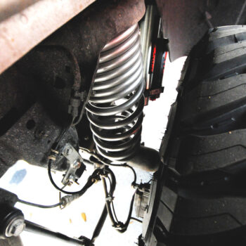 Next Level Silver Dodge Ram Vertex Rough County Suspension and Toyo Open Country Tire Install Orlando