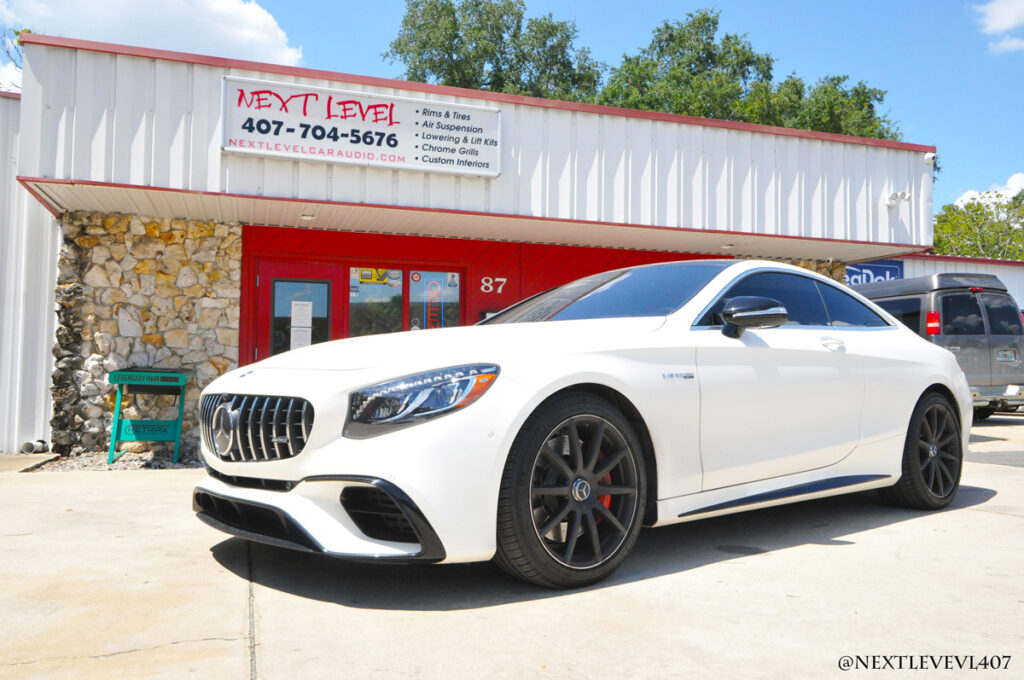 Next Level White Mercedes Benz AMG Front Driver Side