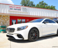 Next Level White Mercedes Benz AMG Front Driver Side
